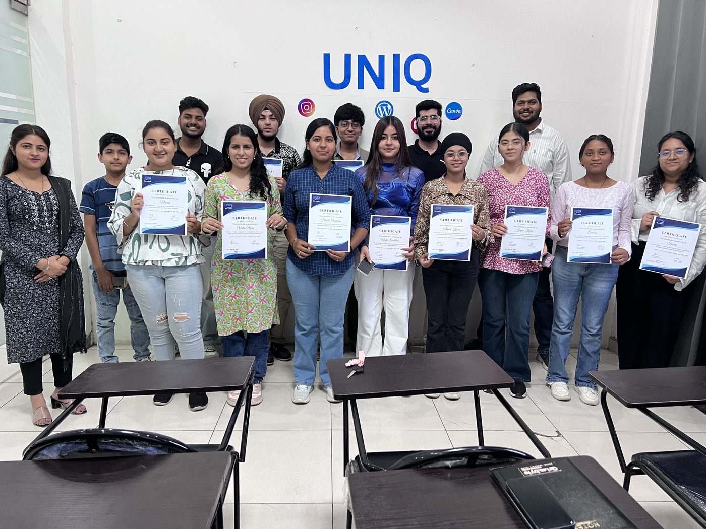 Uniq Shiksha students holding their certificates at the Model Town centre in Karnal